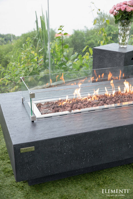 Elementi Hampton fire table lit with lava rocks 45000 BTU rectangular concrete
