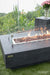Elementi Hampton fire table lit with lava rocks 45000 BTU rectangular concrete