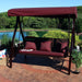 Sunnydaze Deluxe patio swing with canopy on backyard deck at sunset