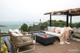 Elementi Granville 60 inch concrete fire pit table on backyard patio